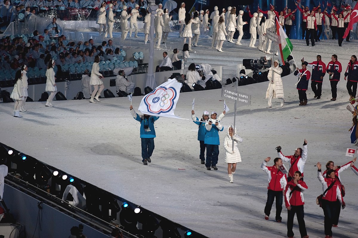 Taiwanese athletes at the 2010 Winter Olympics waving the flag of Chinese Taipei (source: Jude Freedman/Flickr via Wikipedia commons)