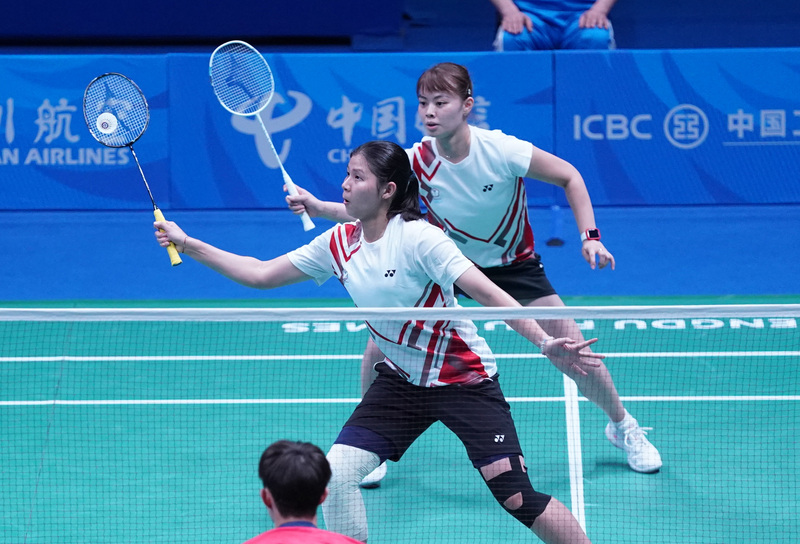 Teng Chun-hsun (avant) et Lee Chia-hsin (arrière) lors du match qui leur a permis de remporter la médaille d'or de badminton dans l'épreuve mixte à l'Universiade de Chengdu (Image : CNA)