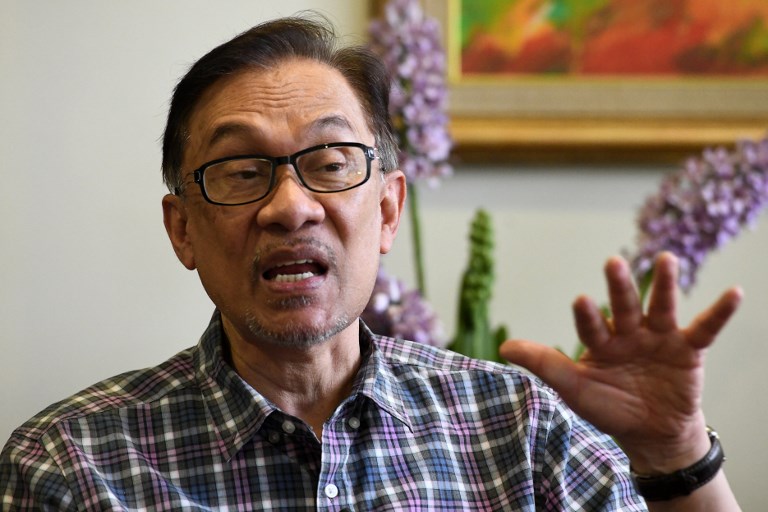 馬來西亞希望聯盟3黨傳出意見一致，支持人民公正黨主席安華接任第八任首相。(AFP)