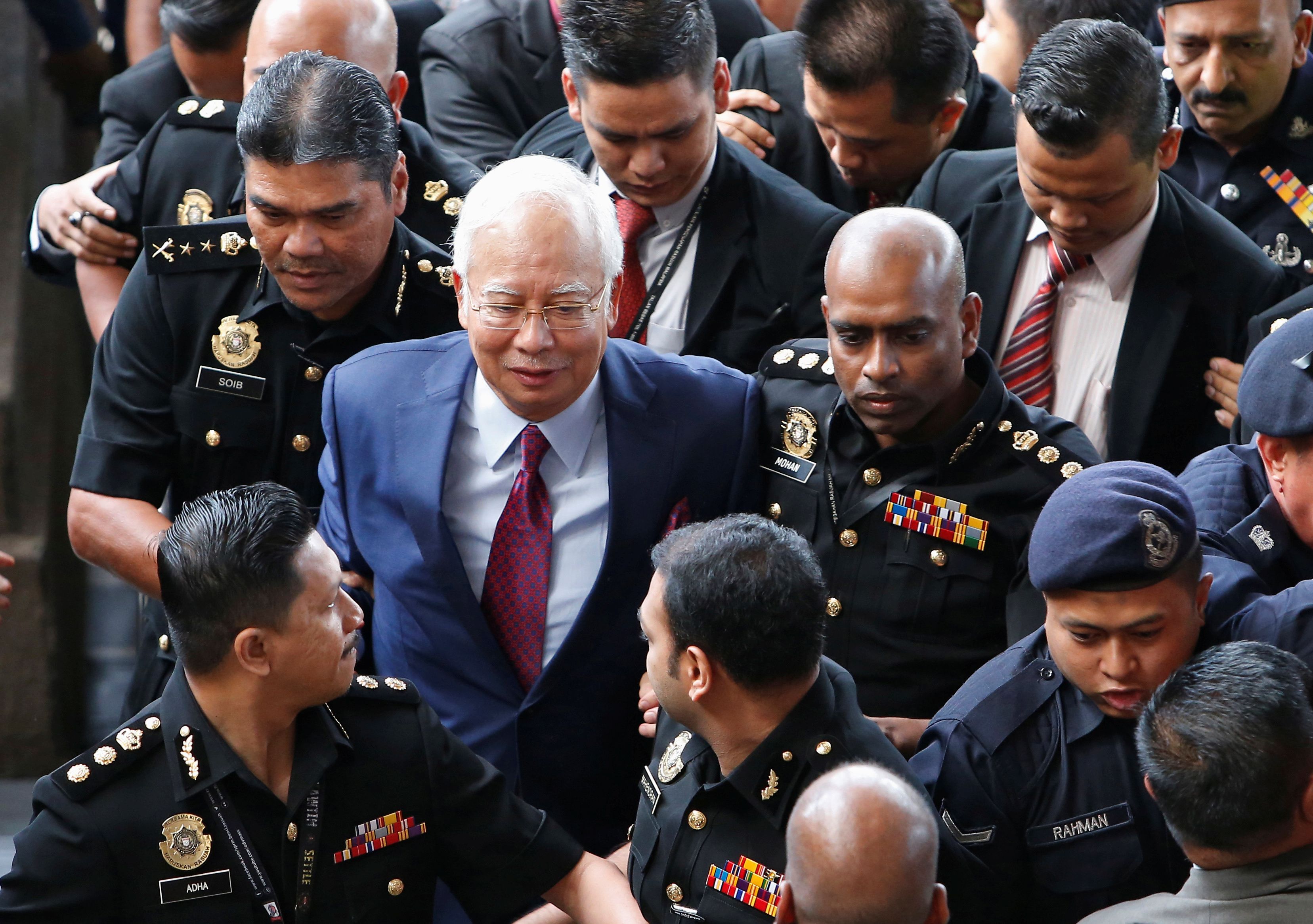 馬來西亞前首相納吉(Najib Razak)(中)濫權罪成立。(路透社/達志影像)