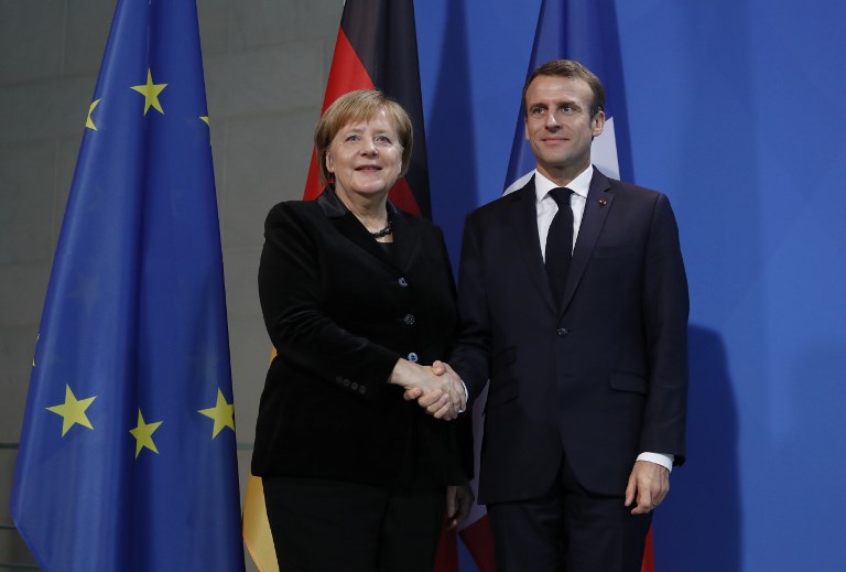 圖為法國總統馬克宏(Emmanuel Macron)與德國總理梅克爾(Angela Merkel)去年11月舉行會談。(資料照片/AFP)