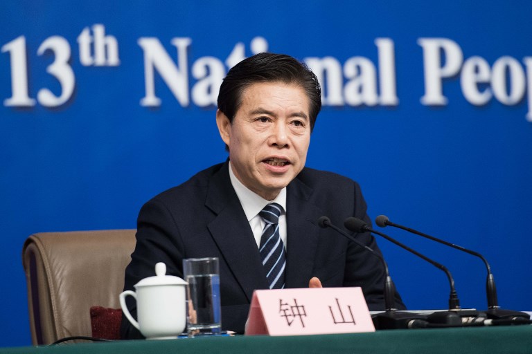 中國商務部長鐘山29日於工作會報中強調2020堅持穩中求進，堅持過「緊日子」。 (AFP)