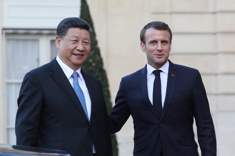 圖為2019年3月，法國總統馬克宏在艾里賽宮與來訪的中國國家主席習近平會談。 (AFP)