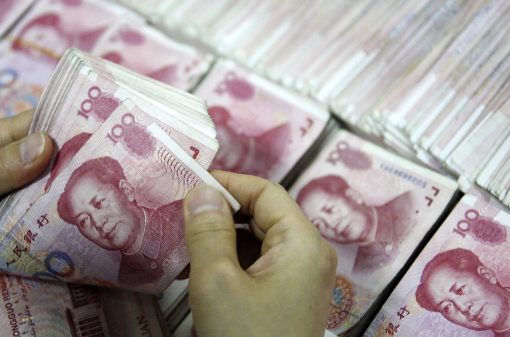 看衰中國貨幣寬鬆救經濟 學者估明年GDP下修至4.5％(AFP)