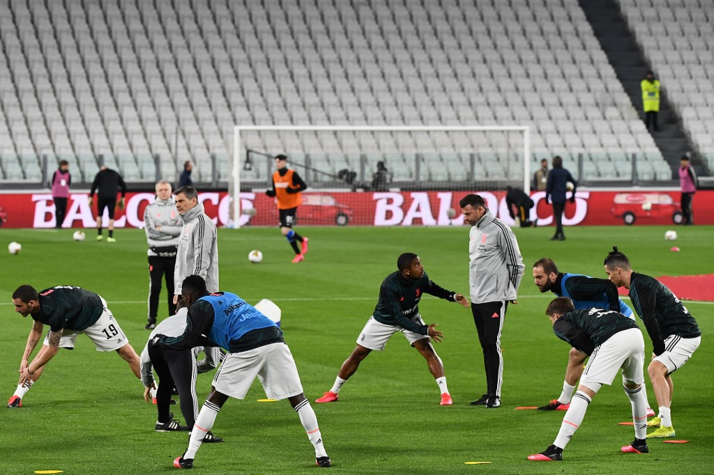 圖為義甲足球勁旅祖文特斯(Juventus)隊在賽前暖身。 (AFP)