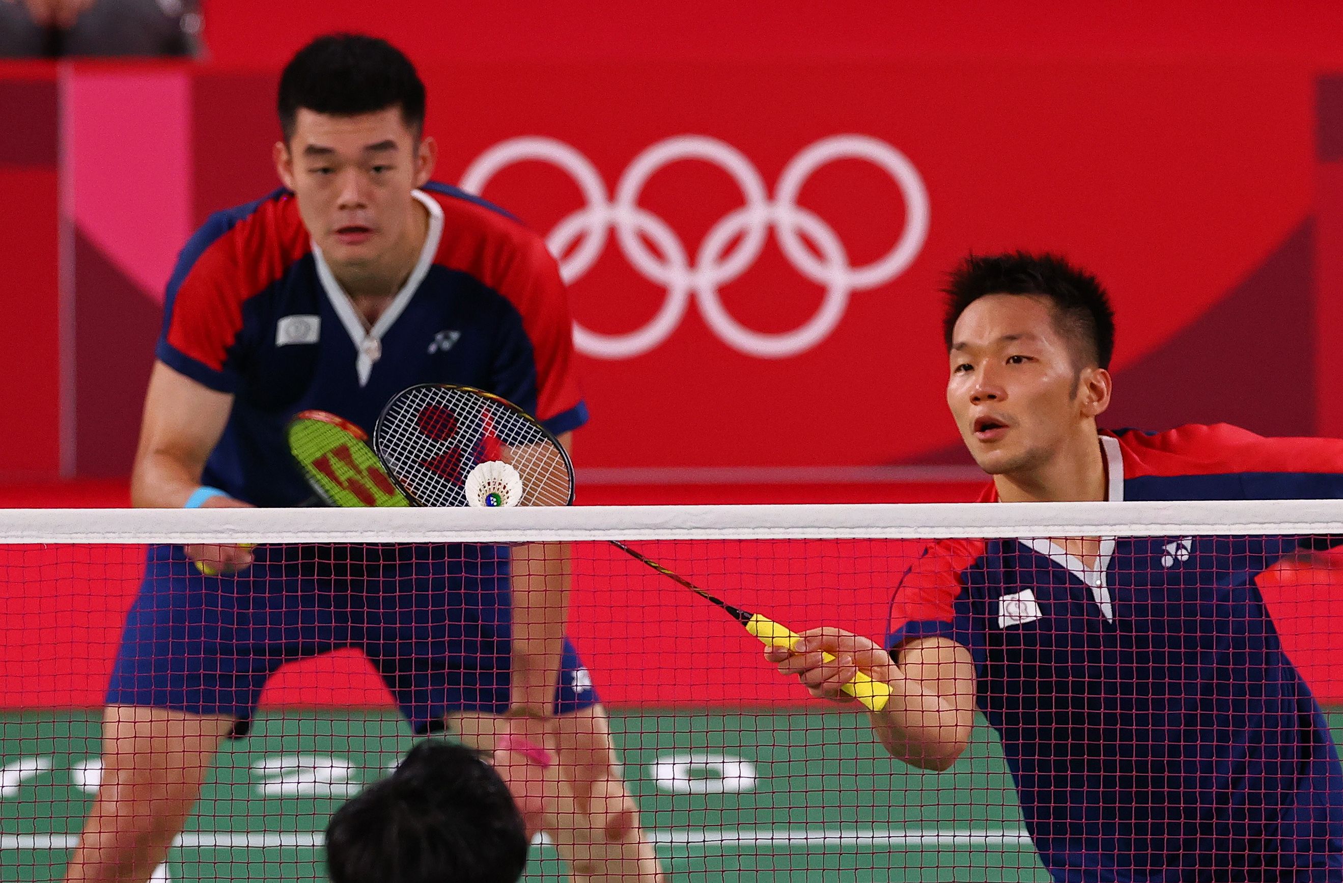 今年東京奧運拿下羽球男雙金牌的「麟洋配」王齊麟與李洋。（路透社／達志影像）