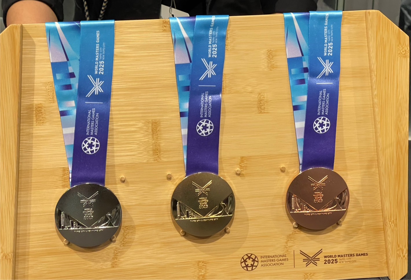 2025世壯運主視覺及獎牌設計融入台北101及新北野柳女王頭。(鄭佑漢攝)