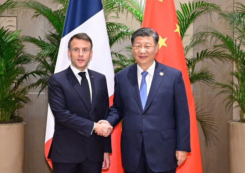 法國總統馬克宏(Emmanuel Macron)與中國國家主席習近平19日在G20峰會舉行場邊會談。(圖:中國政府網)
