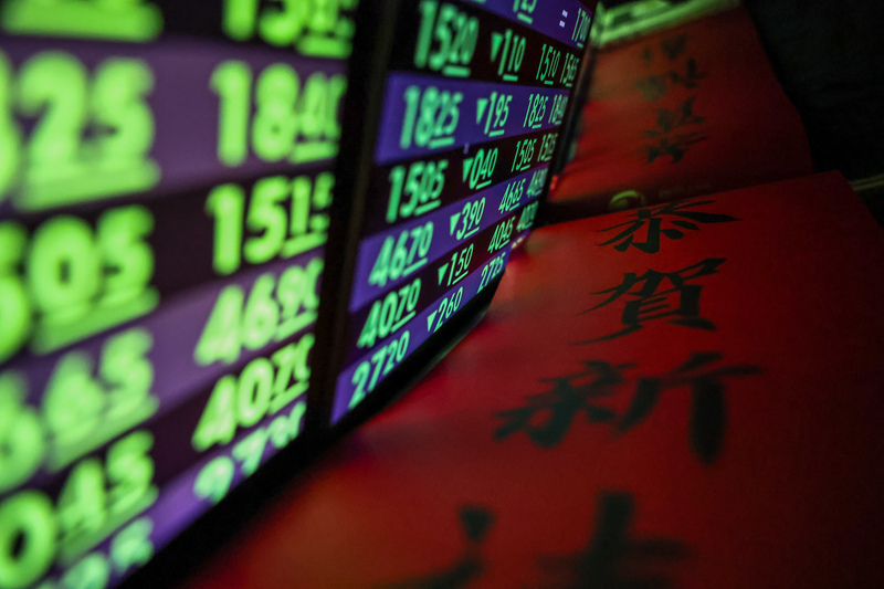 關稅戰開打，台北股市開新春紅盤籠罩陰霾。(圖：中央社)